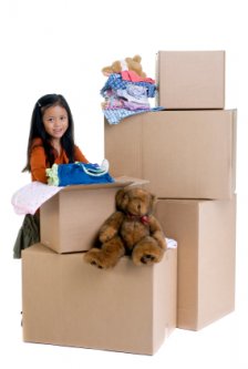 little girl helping to pack up her room