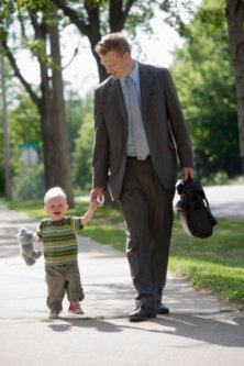 dad and small son walking together