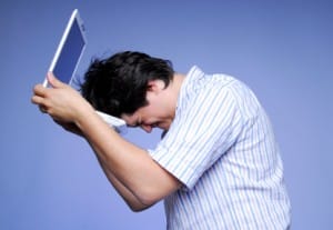 upset-boy-with-laptop cyber bullying - very upset boy and his laptop
