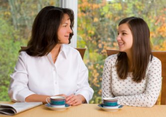 mother and teenage daughter having an early morning talk