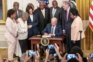 Juneteenth: Teaching Kids about Freedom, Resilience, and Equality 8 Photo of President Biden signing into law new national holiday: Juneteenth