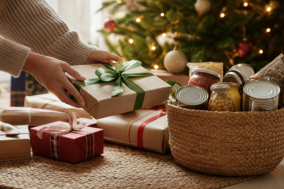 Adopt a Family for Christmas 15 Adopt a family for Christmas: wrapped gifts and food donations by a tree