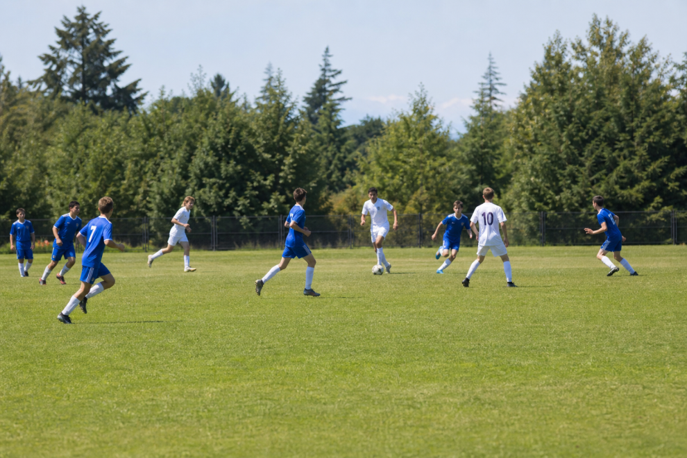 Advantages Of Sports And Teens 15 Teens and sports playing soccer together outdoors
