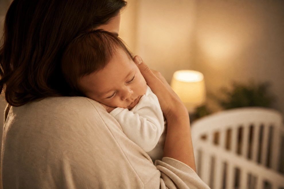 Baby colic relief: parent gently soothing and holding a fussy infant