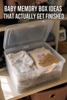 A Shoebox Full of Hospital Bracelets Counts: Realistic Baby Memory Box Ideas 4 Baby memory box ideas — a simple labeled shoebox memory box open on a shelf with a hospital bracelet, a folded going-home outfit, and a few cards inside