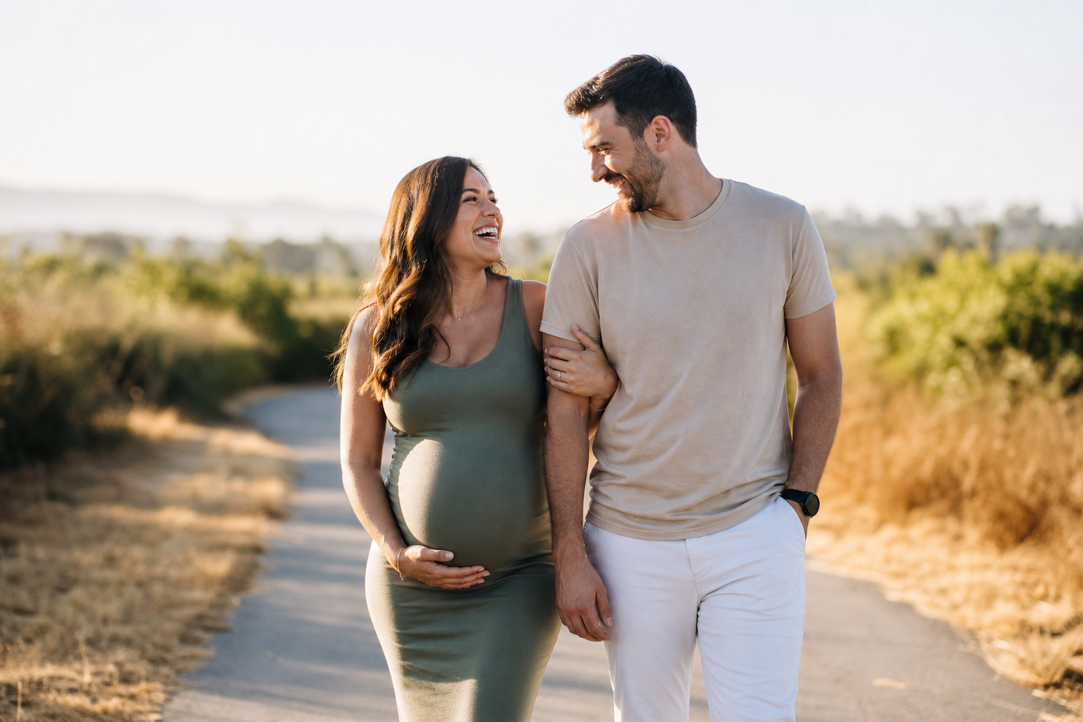 A pregnant woman enjoying a sunny walk with her partner, representing everyday pregnancy life