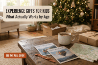 Experience gifts for kids: printed vouchers and a small wrapped box on a Christmas morning coffee table instead of a pile of toys