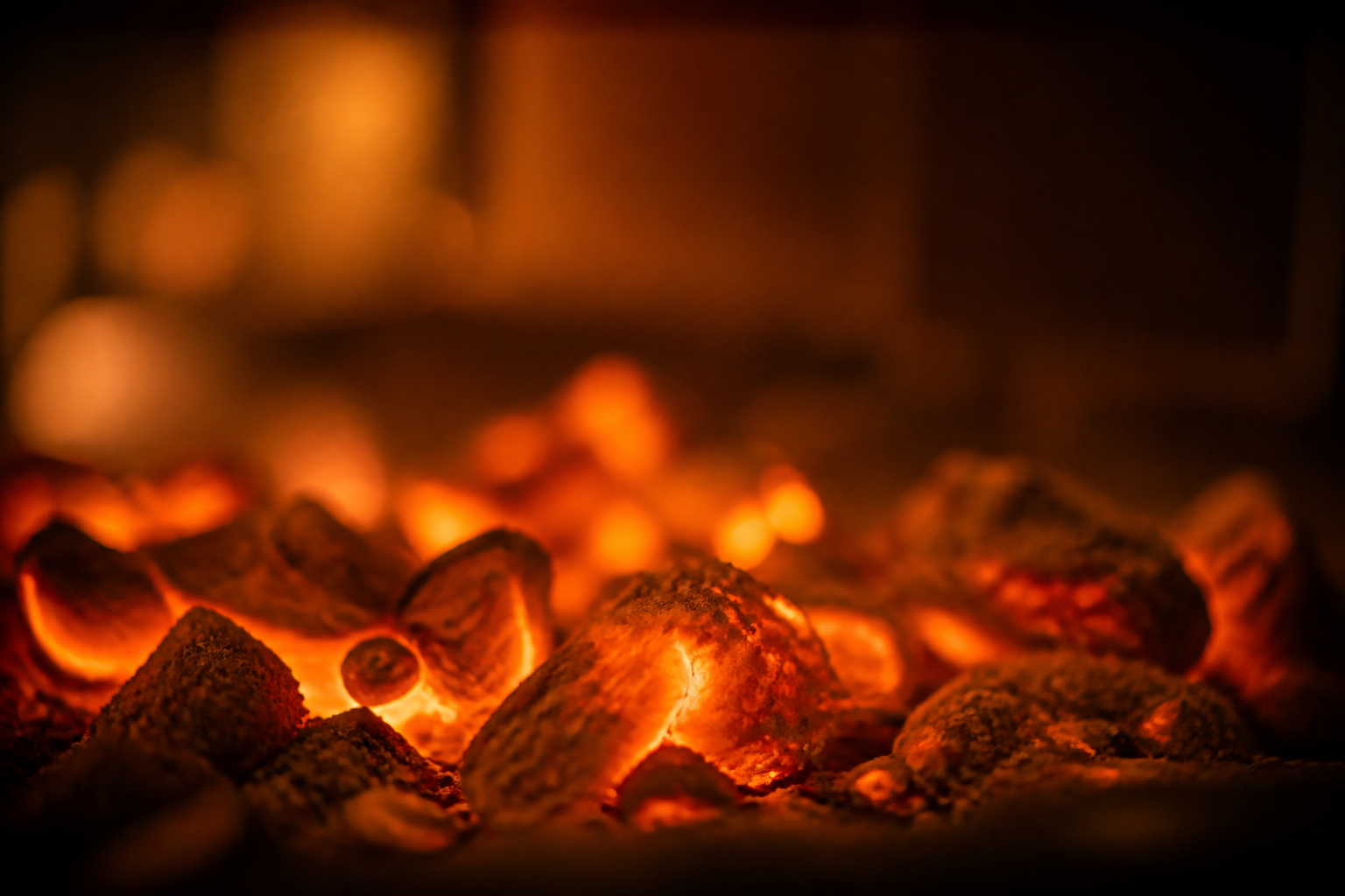Names That Mean Fire: 50+ Warm, Glowing Picks for Your Baby 17 Glowing orange embers in a soft hearth, warm and cozy