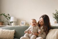 30 Beautiful Gender Neutral Baby Names and Their Meanings 1 Parent and baby looking at a list of gender neutral baby names together at home