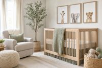 Gender Neutral Nursery Ideas: Simple, Calm Inspiration for a Room That Grows 2 Gender neutral nursery ideas in a sunlit room — a natural-wood crib, soft sage and cream textiles, a woven basket, and framed animal prints, calm and warmly styled.