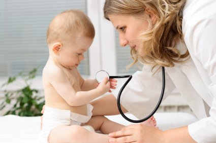 pediatrician examining a baby