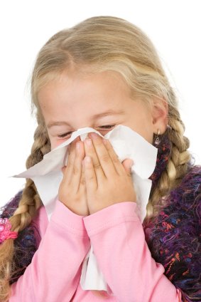Preventing and Reducing Allergies 16 young girl with severe allergies sneezing