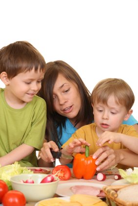 Teaching Your Child The Value Of Good Nutrition 10 mom and sons making a healthy meal together