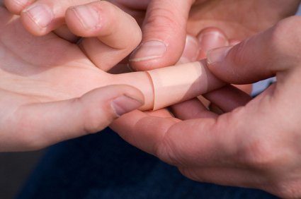 Are You Prepared? Stocking Up Your Families First Aid Kit 10 mommy bandaging sons fingure