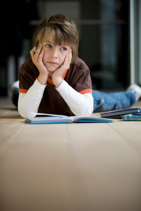 Understanding your Child with ADHD 10 inattentive child looking out window and not doing homework