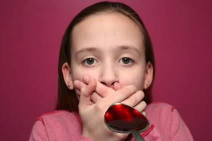 Helping Medicine Go Down A Reluntant Child 10 young girl does not want to take her medicine