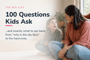 A mother listening to the questions kids ask, sitting on the floor with her curious five-year-old who is mid-question with one hand raised