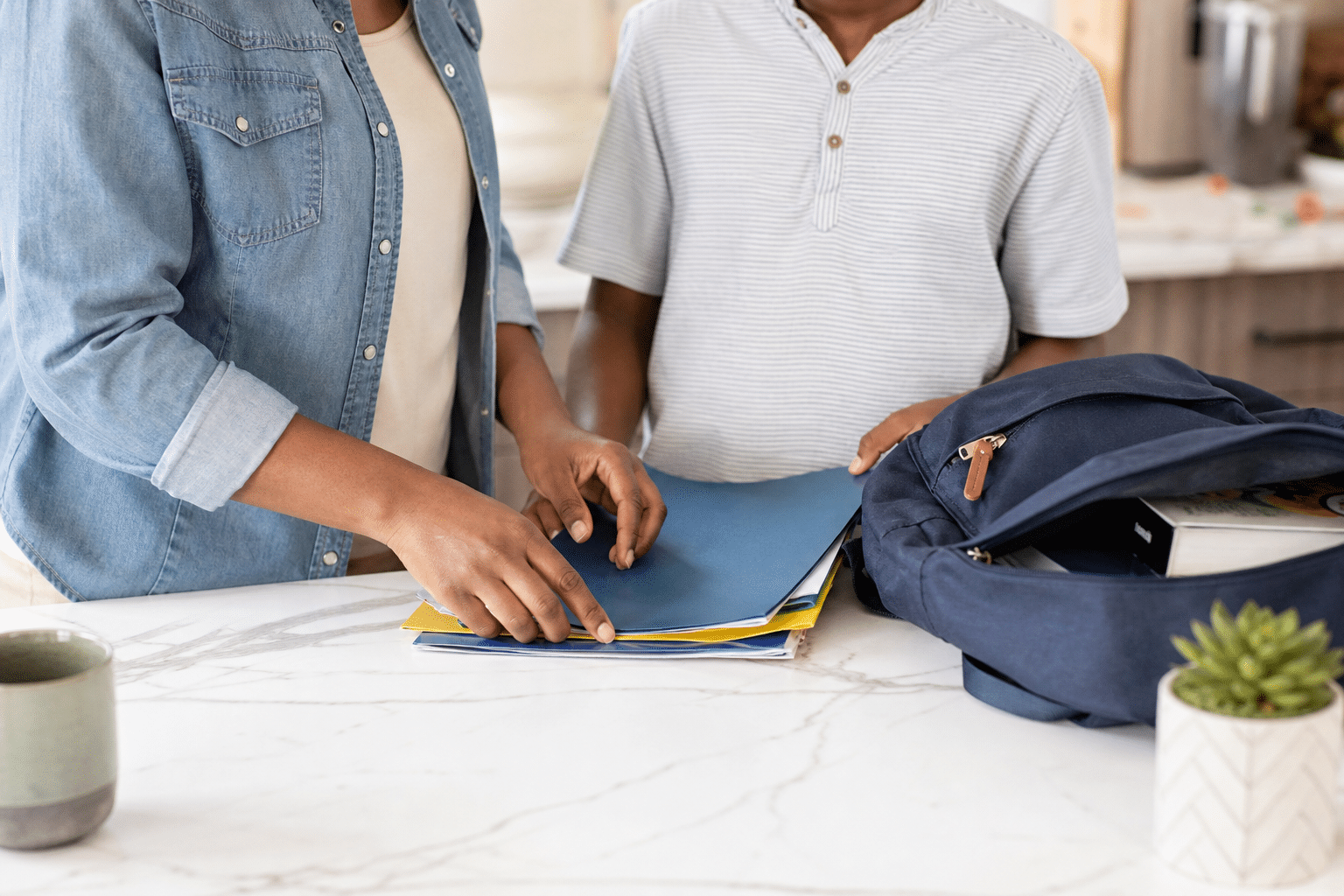 child having problems at school parent reviewing school folder