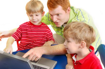 Top Ten Educational Websites for the Homeschool Family 8 older brother helping younger brothers learn on the internet