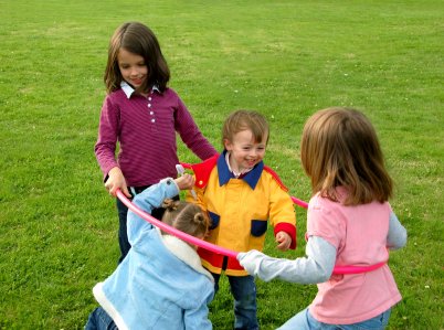 Socialization Ideas for the Homeschooled Child 7 homechooled kids from different families playing together in park -