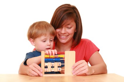 Math Concepts and Skills by Age 8 mom helping son learn to count