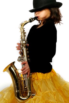 young girl playing saxaphone