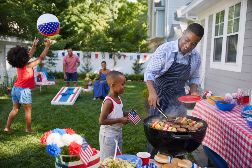 Memorial Day Game And Party Ideas 15 Family enjoying Memorial Day games and a backyard cookout