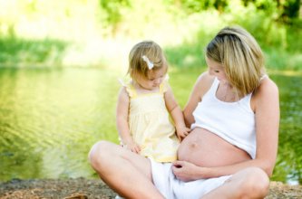 The Joy of Pregnancy 8 pregnant woman with daughter enjoying afternoon at the park