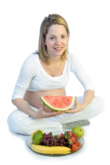 pregnant women eating a healthy snack