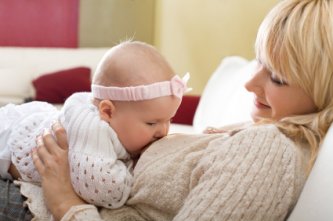 Breastfeeding - Pros and Cons 8 Happy Mom breastfeeding her baby girl