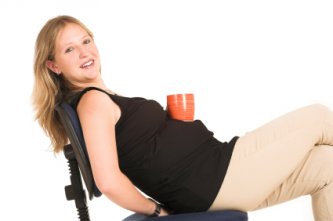 pregnant woman drinking coffee