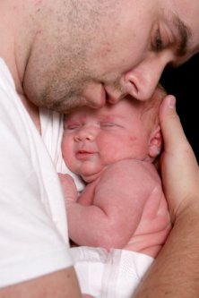 Pregnancy, Childbirth and Your Newborn - Now What? 7 new dad in loving embrace of his newborn