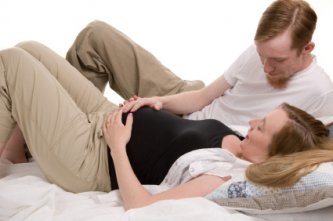 Young happy couple in childbirth class