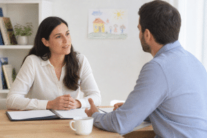 co-parents discussing a parenting plan at a table