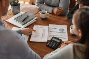 family budget tips - family reviewing household budget at kitchen table