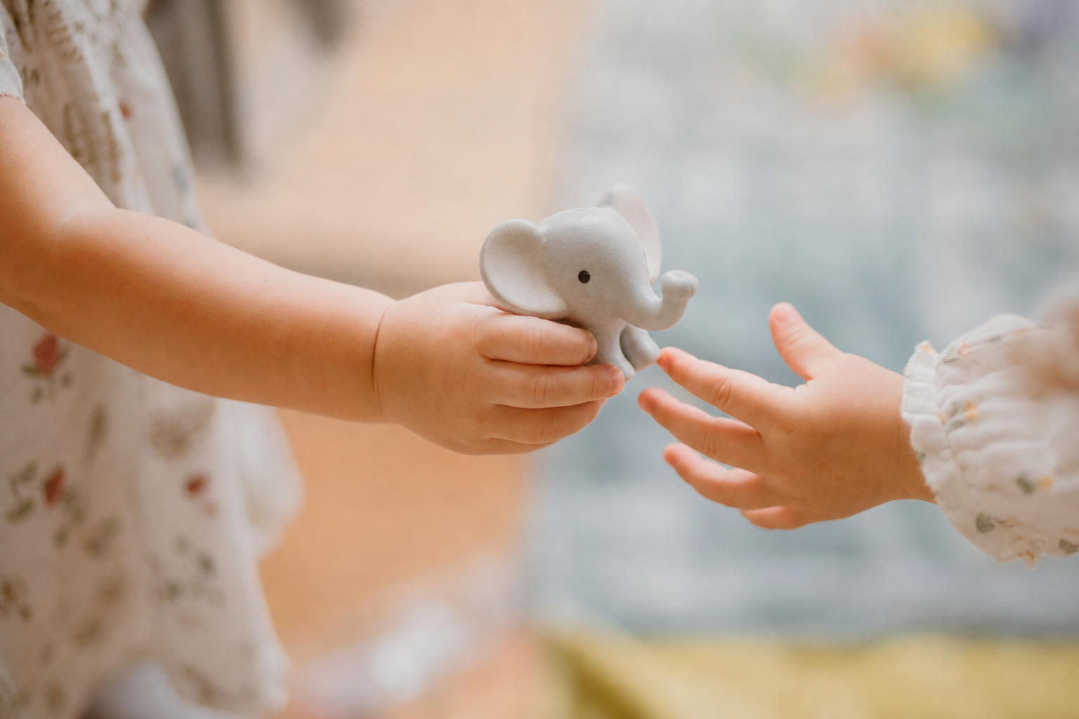 Tips For Teaching Toddlers To Share 17 Toddler sharing a toy by handing it to another child