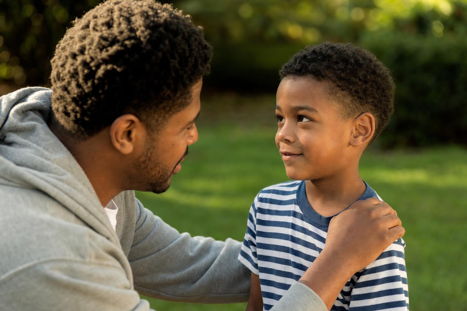 Why Do Kids Lie? A Simple, Calm Guide to Raising Honest Kids 18 A parent kneeling at a child's eye level outdoors having a warm, encouraging conversation about telling the truth, gentle and supportive
